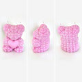 Bougie ourson rose sculpté de roses, édition solidaire Octobre Rose - L'instant Fondant